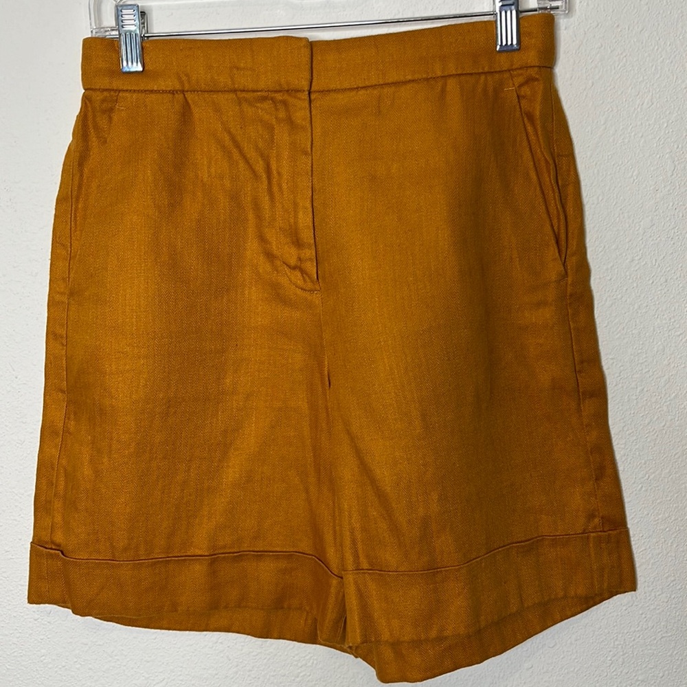 J. Crew size 0 dressy shorts in a goldish color. Pockets front and back